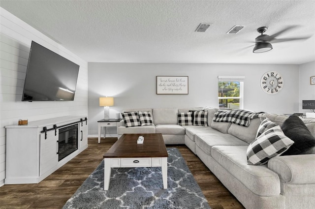 7 Grand Par Ct, Bunnell, FL 32110 - living room featuring ceiling fan, dark wood-style flooring, and a textured ceiling