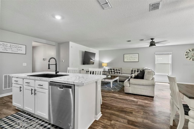 7 Grand Par Ct, Bunnell, FL 32110 - kitchen with dishwasher, open floor plan, dark wood-type flooring, and a textured ceiling