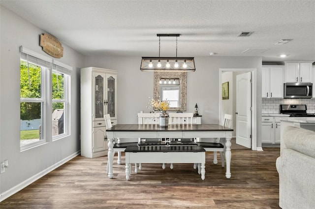 7 Grand Par Ct, Bunnell, FL 32110 - dining area with wood finished floors and a textured ceiling