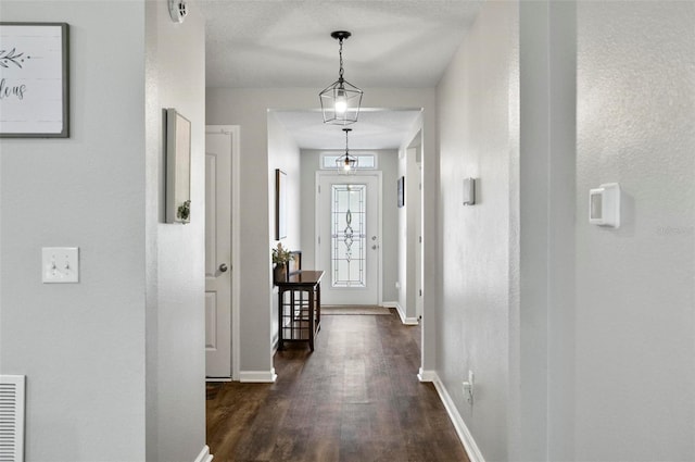 7 Grand Par Ct, Bunnell, FL 32110 - corridor featuring dark wood-type flooring and baseboards