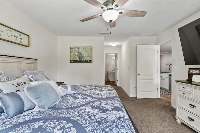 7 Grand Par Ct, Bunnell, FL 32110 - bedroom featuring dark carpet, ensuite bathroom, a ceiling fan, and a textured ceiling