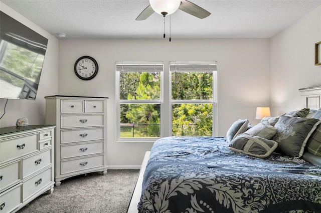 7 Grand Par Ct, Bunnell, FL 32110 - bedroom with dark carpet, a textured ceiling, and a ceiling fan