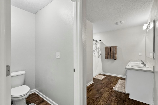 7 Grand Par Ct, Bunnell, FL 32110 - full bath featuring wood finished floors, double vanity, and a textured ceiling