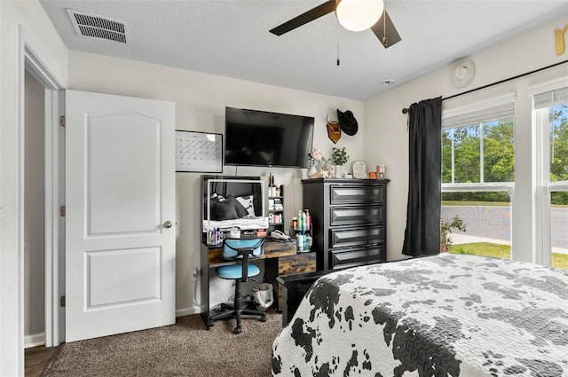 7 Grand Par Ct, Bunnell, FL 32110 - carpeted bedroom with an office area and ceiling fan