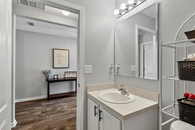 7 Grand Par Ct, Bunnell, FL 32110 - bathroom featuring wood finished floors and vanity