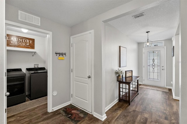 7 Grand Par Ct, Bunnell, FL 32110 - entrance foyer with washing machine and clothes dryer, wood finished floors, and a textured ceiling