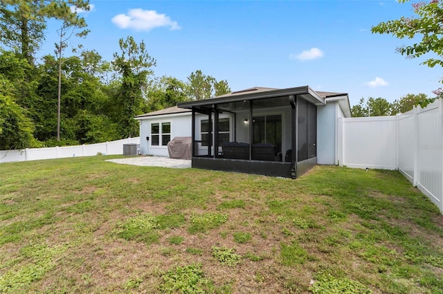 7 Grand Par Ct, Bunnell, FL 32110 - back of house with a sunroom, a fenced backyard, and a patio