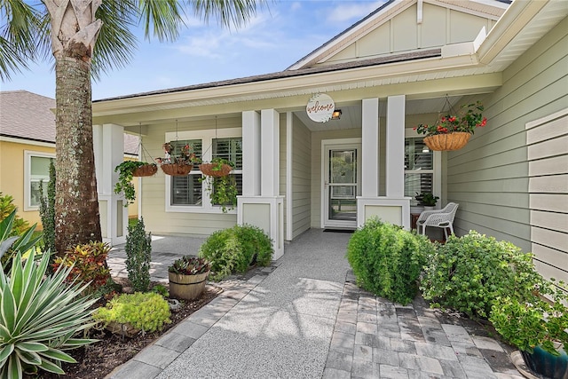 166 Midway Park Dr, Saint Augustine, FL 32084 - doorway to property featuring board and batten siding and covered porch