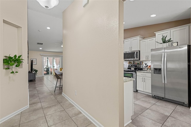 166 Midway Park Dr, Saint Augustine, FL 32084 - corridor with light tile patterned floors and recessed lighting