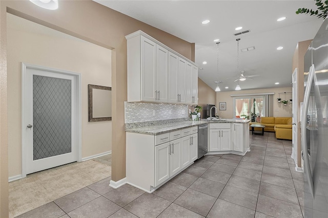 166 Midway Park Dr, Saint Augustine, FL 32084 - kitchen with stainless steel appliances, open floor plan, a ceiling fan, a peninsula, and white cabinetry
