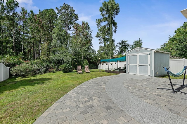 166 Midway Park Dr, Saint Augustine, FL 32084 - view of yard featuring a storage unit and a patio