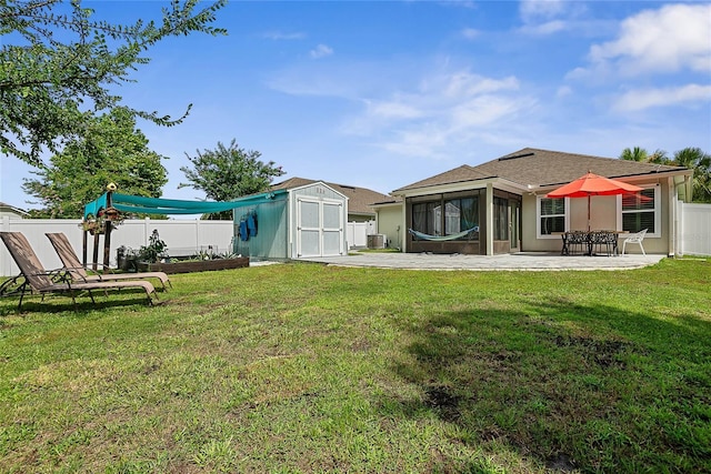 166 Midway Park Dr, Saint Augustine, FL 32084 - rear view of house with a shed, a sunroom, a fenced backyard, and a patio