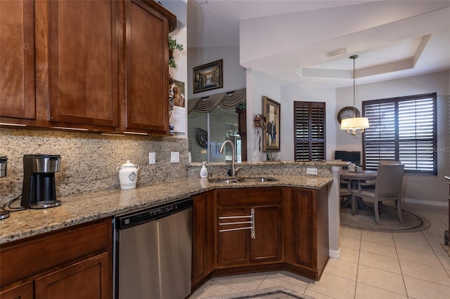 25 Raintree Cir, Palm Coast, FL 32164 - kitchen featuring stainless steel dishwasher, a peninsula, tasteful backsplash, light tile patterned floors, and light stone counters