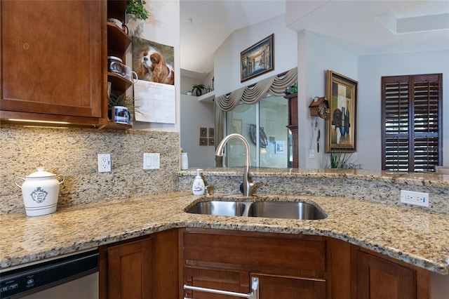25 Raintree Cir, Palm Coast, FL 32164 - kitchen with stainless steel dishwasher, open shelves, backsplash, light stone counters, and lofted ceiling