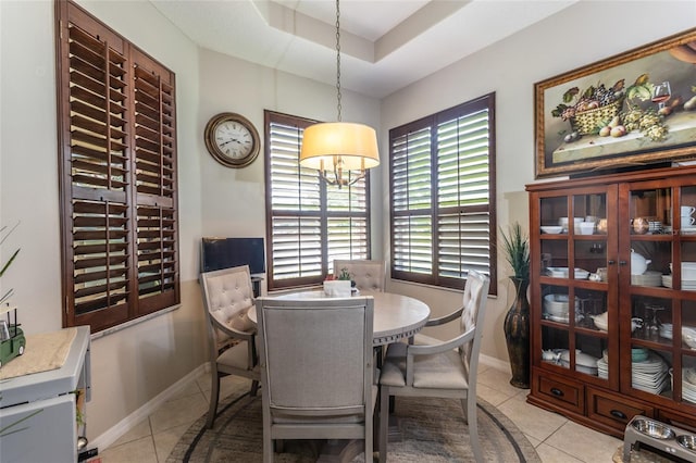 25 Raintree Cir, Palm Coast, FL 32164 - dining area featuring light tile patterned floors and a raised ceiling
