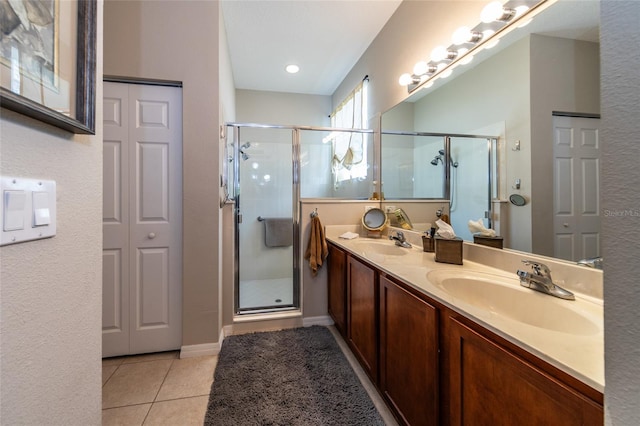 25 Raintree Cir, Palm Coast, FL 32164 - bathroom with a shower stall, tile patterned flooring, and double vanity