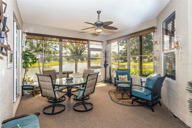 25 Raintree Cir, Palm Coast, FL 32164 - sunroom with a ceiling fan, a water view, and outdoor dining area