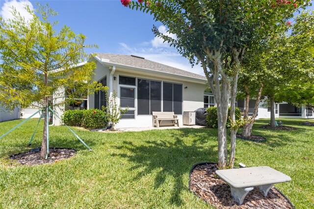 25 Raintree Cir, Palm Coast, FL 32164 - back of house with a lawn and stucco siding