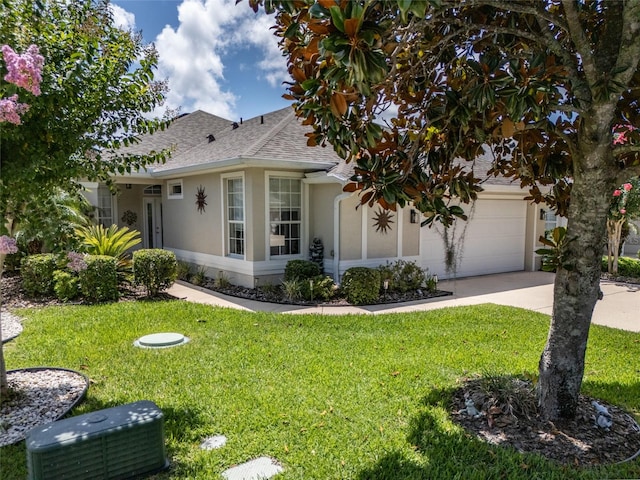 25 Raintree Cir, Palm Coast, FL 32164 - view of front of property with stucco siding, roof with shingles, a front lawn, and concrete driveway