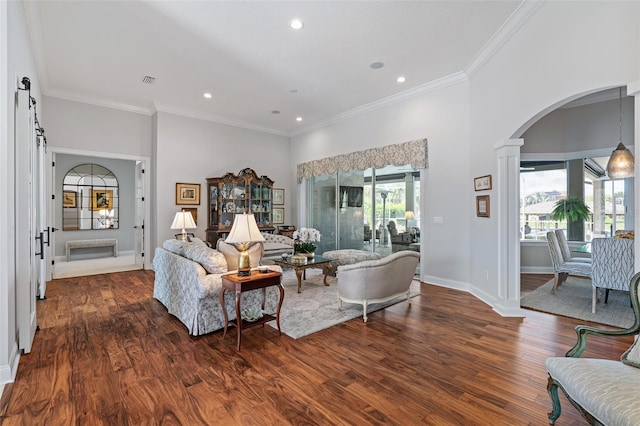 4 Old Oak Dr N, Palm Coast, FL 32137 - living room featuring arched walkways, wood finished floors, recessed lighting, crown molding, and ornate columns