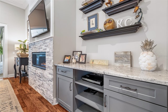 4 Old Oak Dr N, Palm Coast, FL 32137 - bar with dark wood-style flooring and a fireplace