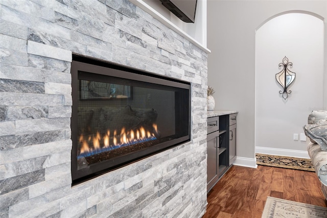 4 Old Oak Dr N, Palm Coast, FL 32137 - detailed view of a glass covered fireplace, arched walkways, and wood finished floors