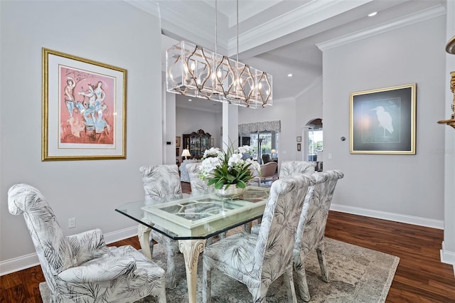 4 Old Oak Dr N, Palm Coast, FL 32137 - dining room with arched walkways, ornamental molding, a chandelier, wood finished floors, and recessed lighting