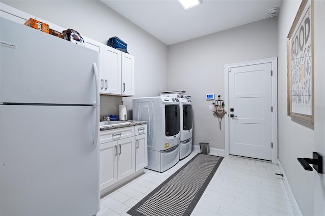 4 Old Oak Dr N, Palm Coast, FL 32137 - laundry room with washer and clothes dryer and cabinet space