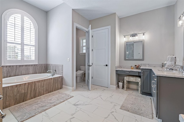 4 Old Oak Dr N, Palm Coast, FL 32137 - full bath with marble finish flooring, a garden tub, and vanity