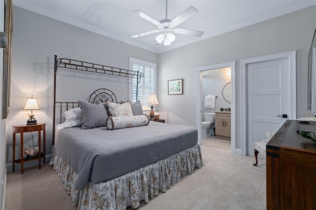 4 Old Oak Dr N, Palm Coast, FL 32137 - bedroom with light colored carpet, ornamental molding, ensuite bath, and a ceiling fan