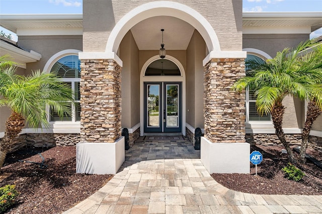 4 Old Oak Dr N, Palm Coast, FL 32137 - doorway to property featuring stone siding and stucco siding