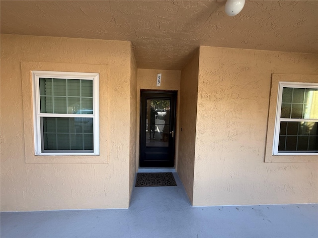 59 Rivers Edge Ln Unit 59, Palm Coast, FL 32137 - view of exterior entry featuring stucco siding