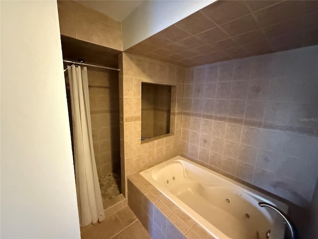 59 Rivers Edge Ln Unit 59, Palm Coast, FL 32137 - full bathroom with a jetted tub, a shower stall, and tile patterned flooring