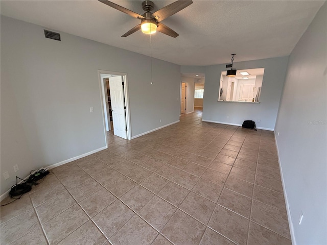59 Rivers Edge Ln Unit 59, Palm Coast, FL 32137 - unfurnished living room with ceiling fan and light tile patterned floors