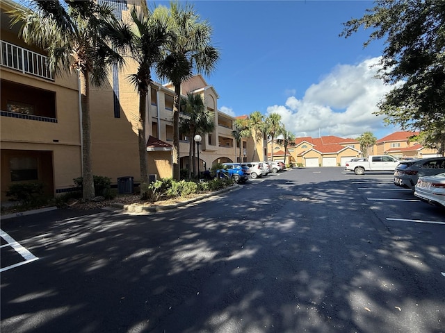 59 Rivers Edge Ln Unit 59, Palm Coast, FL 32137 - view of asphalt road with a residential view, street lighting, and curbs