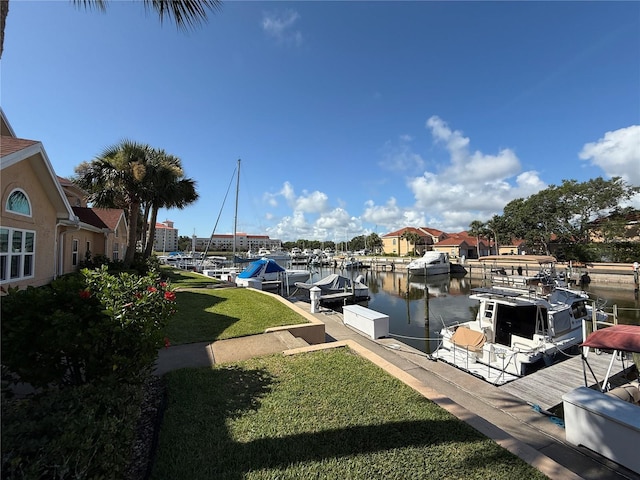 59 Rivers Edge Ln Unit 59, Palm Coast, FL 32137 - view of green lawn featuring a boat dock and a water view