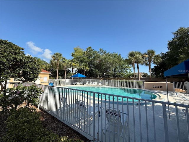 59 Rivers Edge Ln Unit 59, Palm Coast, FL 32137 - community pool featuring a patio area