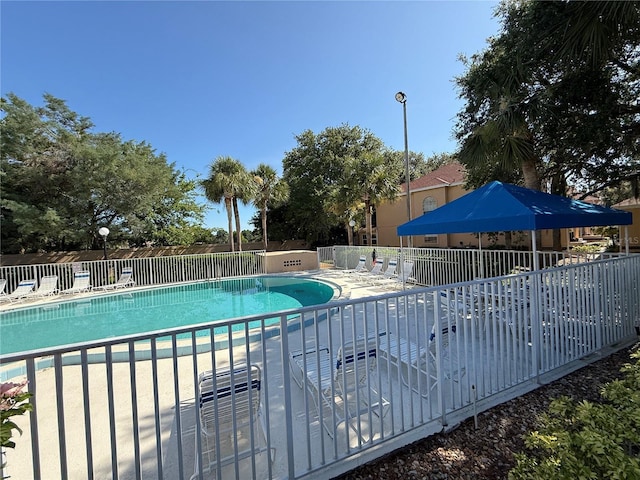 59 Rivers Edge Ln Unit 59, Palm Coast, FL 32137 - community pool featuring a patio