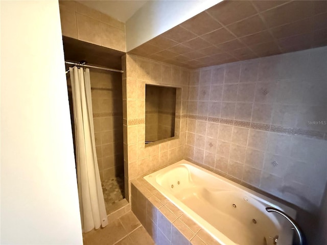 59 Rivers Edge Ln Unit 59, Palm Coast, FL 32137 - full bathroom featuring a whirlpool tub, a stall shower, and tile patterned flooring
