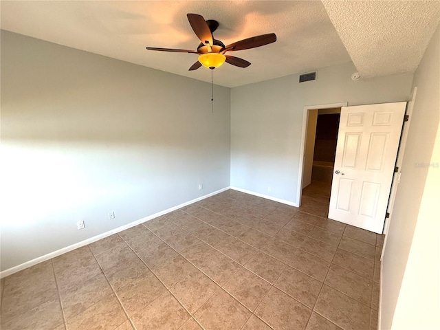 59 Rivers Edge Ln Unit 59, Palm Coast, FL 32137 - unfurnished room with tile patterned flooring, ceiling fan, and a textured ceiling