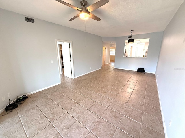 59 Rivers Edge Ln Unit 59, Palm Coast, FL 32137 - unfurnished living room featuring a ceiling fan and light tile patterned floors