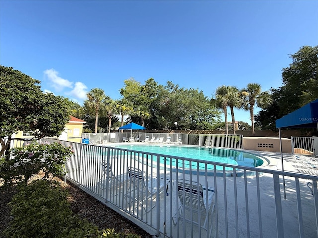 59 Rivers Edge Ln Unit 59, Palm Coast, FL 32137 - community pool with a patio