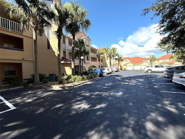 59 Rivers Edge Ln Unit 59, Palm Coast, FL 32137 - view of asphalt road featuring a residential view, street lights, and curbs