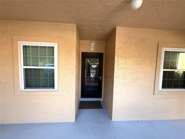 59 Rivers Edge Ln Unit 59, Palm Coast, FL 32137 - property entrance with stucco siding