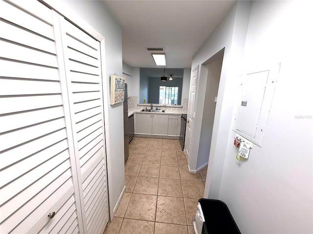 59 Rivers Edge Ln Unit 59, Palm Coast, FL 32137 - hallway with light tile patterned floors and electric panel
