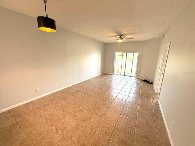 59 Rivers Edge Ln Unit 59, Palm Coast, FL 32137 - empty room with a ceiling fan, light tile patterned floors, and a textured ceiling