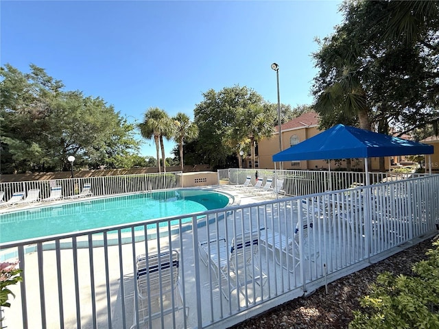 59 Rivers Edge Ln Unit 59, Palm Coast, FL 32137 - community pool featuring a patio area