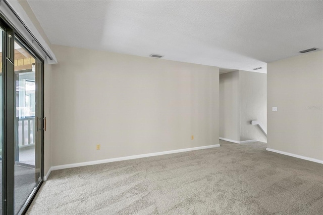 14 Oakmont Ct Unit 14, Palm Coast, FL 32137 - empty room with carpet and a textured ceiling