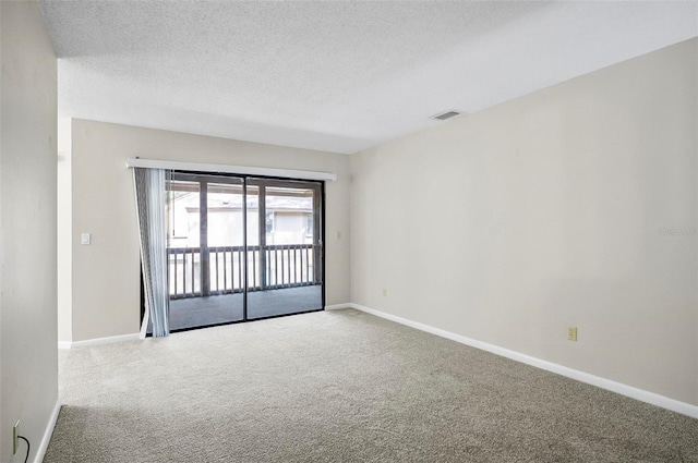 14 Oakmont Ct Unit 14, Palm Coast, FL 32137 - carpeted spare room with baseboards and a textured ceiling
