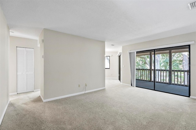 14 Oakmont Ct Unit 14, Palm Coast, FL 32137 - unfurnished room featuring carpet floors and a textured ceiling
